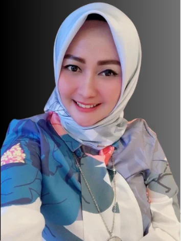 Dr. Hj. Aris Yulia professional portrait in legal office